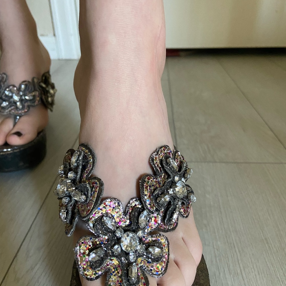 Fun iridescent flip flops. Rarely worn. By Carlos shoes.